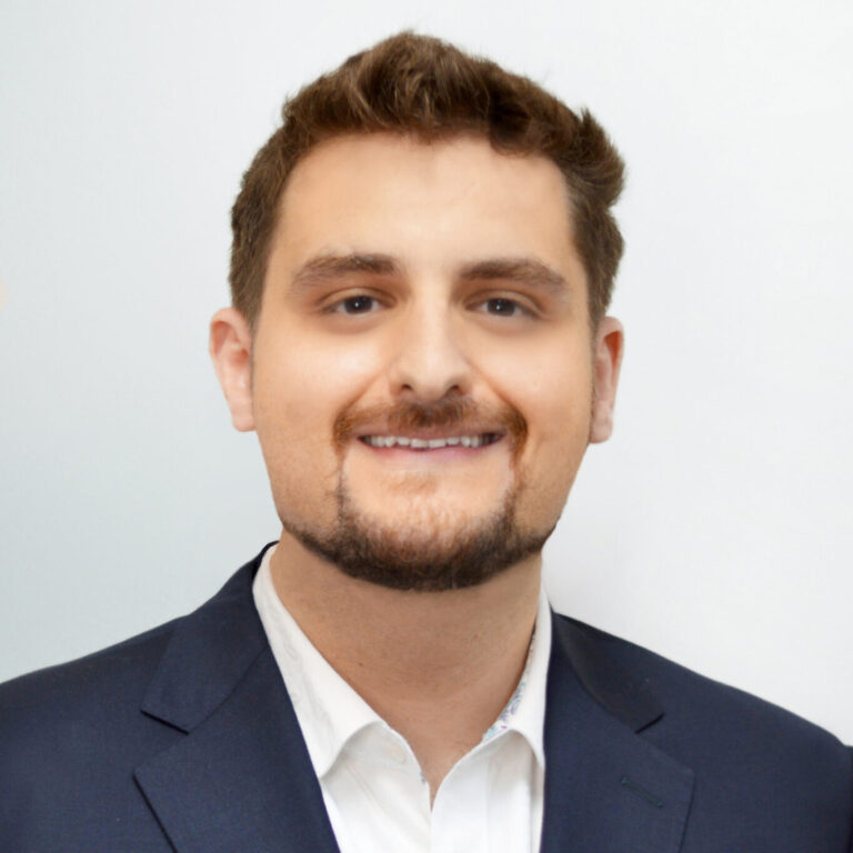 Headshot of Dr. Nawlo, Marine Park Dentist, smiling in a professional setting