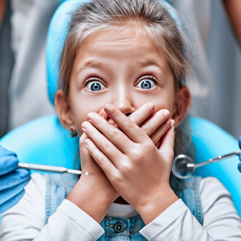 A little girl scared of the dentist