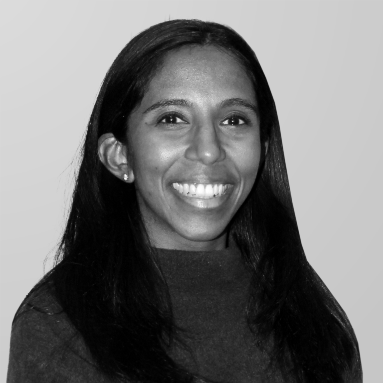 Dr. Sneha Mohan, dentist at Midtown Dental Group Upper East Side and Fashion District in Manhattan, smiling warmly in a professional headshot