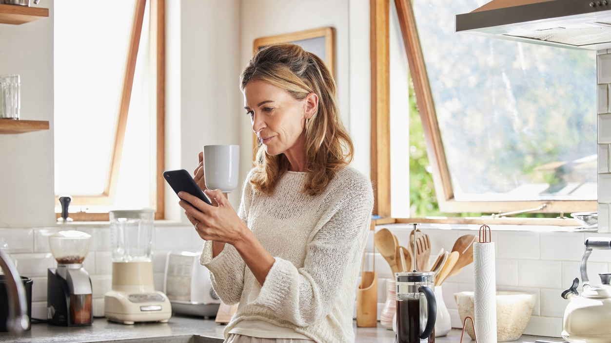 Woman receiving an alert from Midtown Dental Group