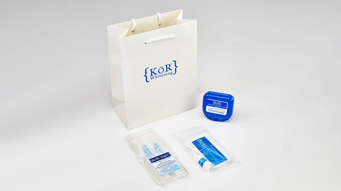 KöR Whitening Trays and Gel – Professional Teeth Whitening Kit with Gift Bag KöR Whitening System kit including whitening trays, refrigerated gel, and branded gift bag for professional teeth whitening