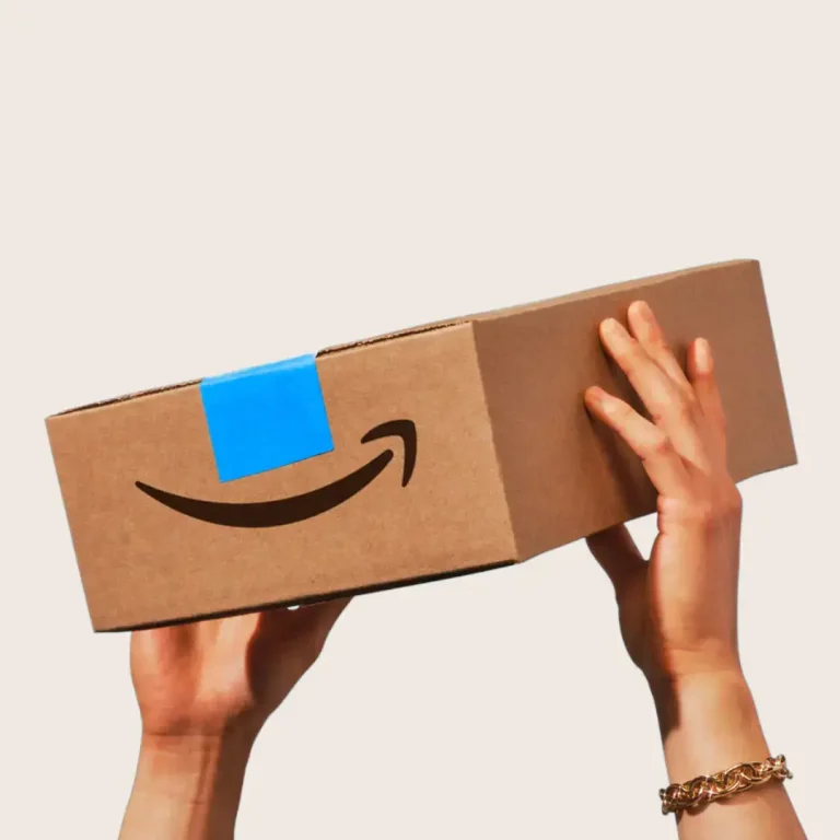 A smiling person holds an open Amazon Prime box containing dental care products like toothbrushes, flossers, and whitening kits, representing Midtown Dental Group’s Prime Day dentist-approved picks