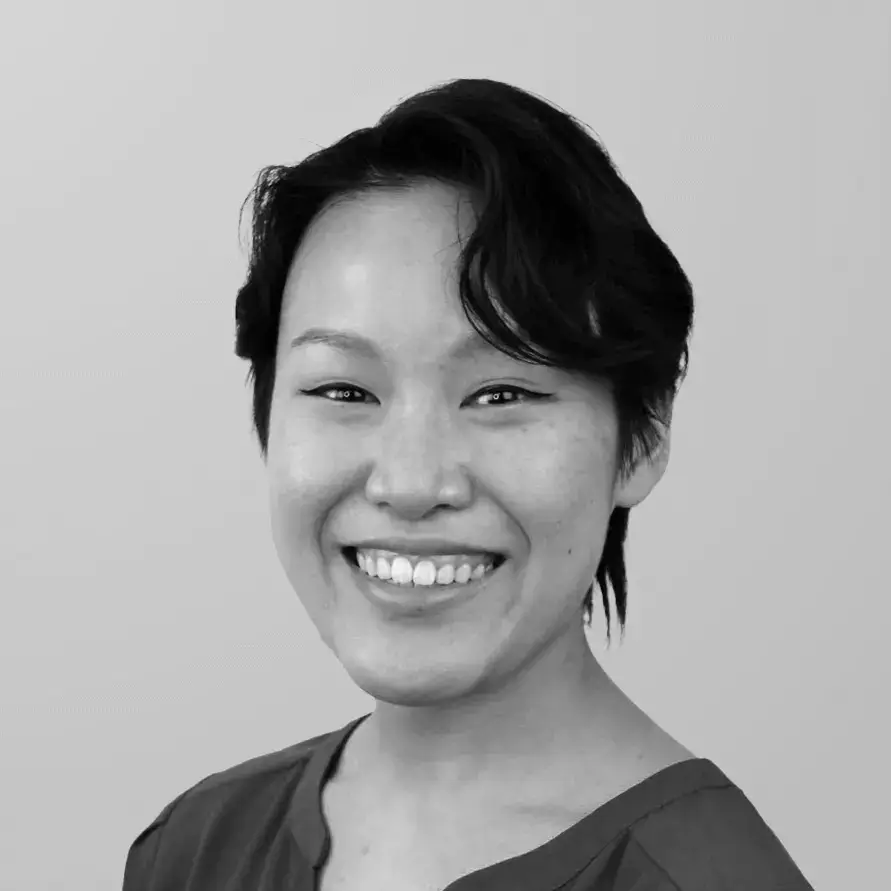 Professional headshot of Dr. Casandra Wang, DMD, a general dentist at Midtown Dental Group Upper East Side, smiling in front of a neutral background