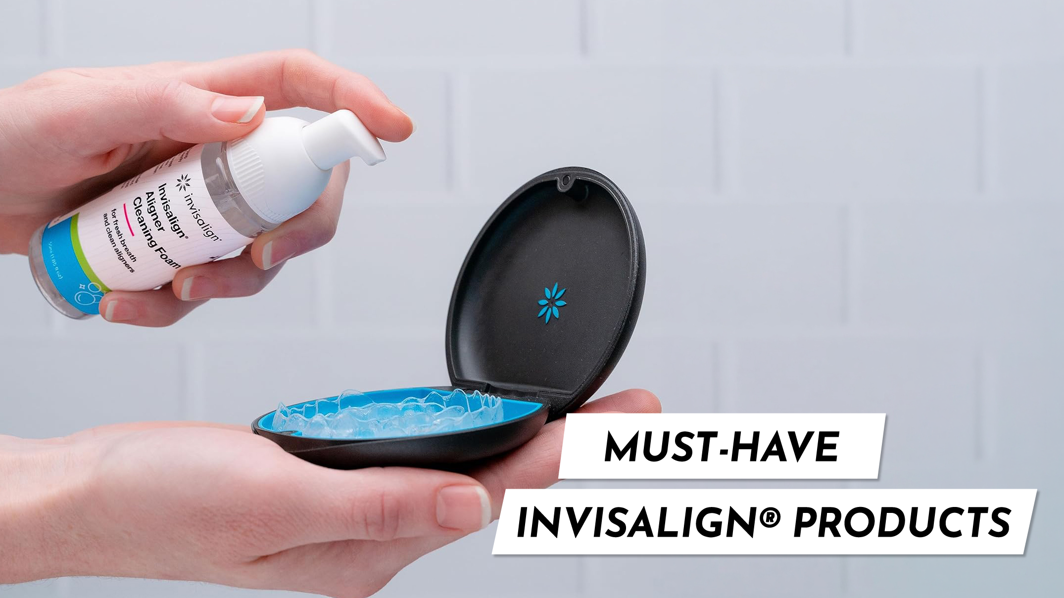 Person applying Invisalign cleaner foam directly onto clear aligners for quick, mess-free daily cleaning.