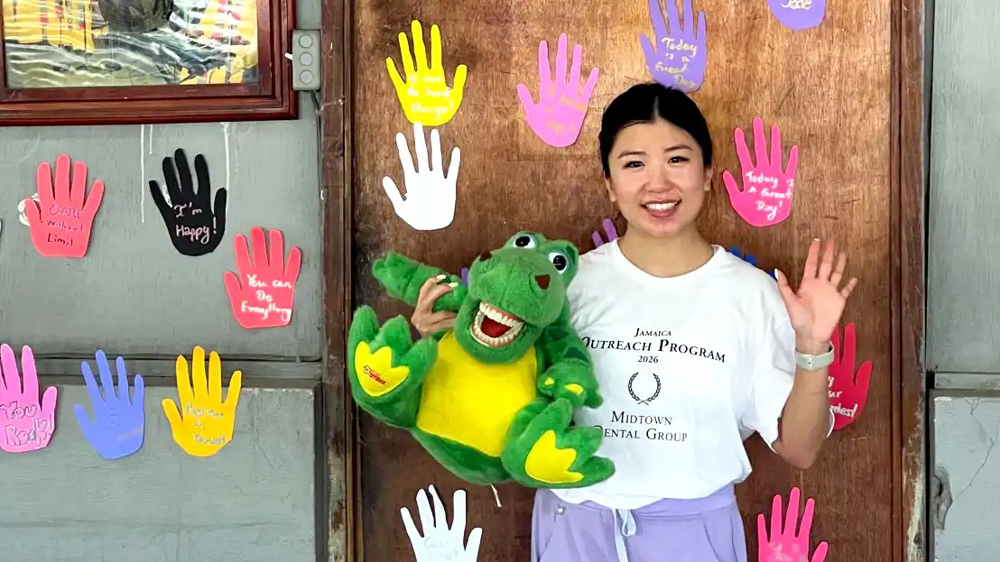 Midtown Dental Group team member shares oral health education tips with community members during a mission trip